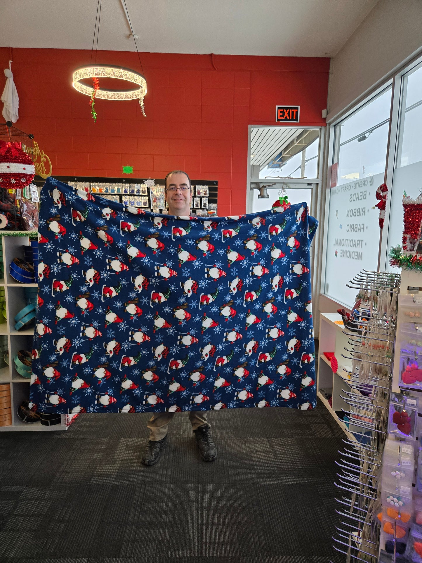 Blue fabric with Santa Gnome pattern.